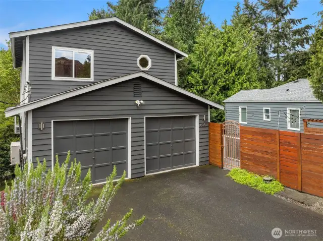 391 sqft 2-car garage with custom built-in high-reach shelving, washer and dryer, and all the storage space needed to maintain your beautiful garden.