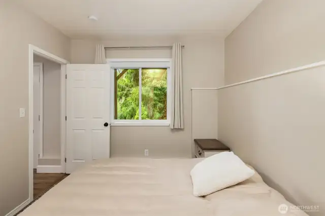 Guest bedroom located on the lower level, with potential for an accessory dwelling unit.
