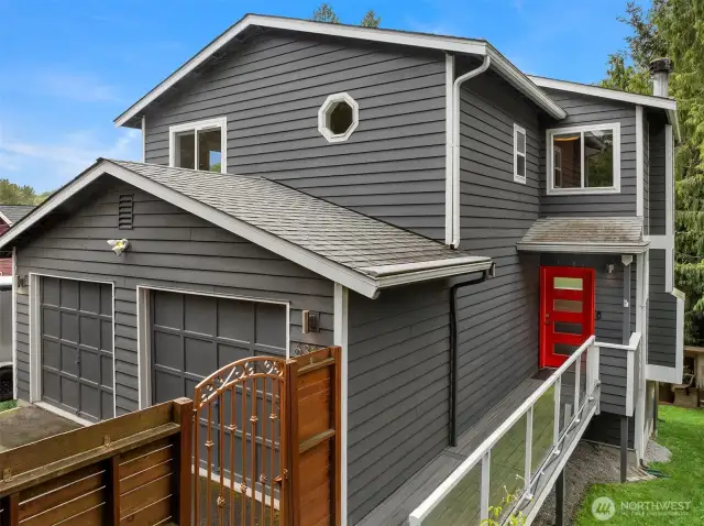 Step through the secure metal gate into your east-facing front patio — a private, peaceful welcome home. With a Ring doorbell, floodlight, and full-home security system already in place, you can relax knowing safety and serenity come standard.