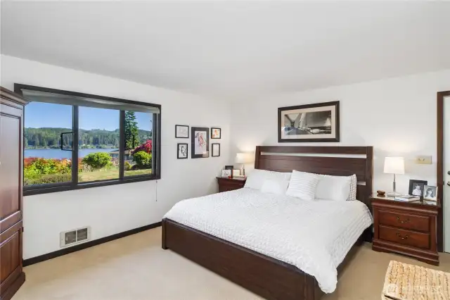 The spacious primary ensuite enjoys east-facing views of the Cascade mountains and Port Ludlow Bay.