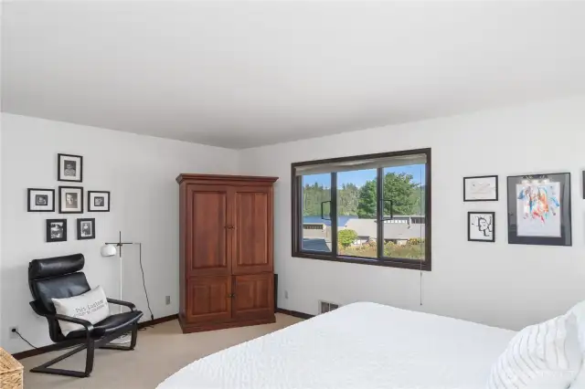 Another view of the primary, water-side ensuite. Plenty of room for a King size bed and night stands and more.