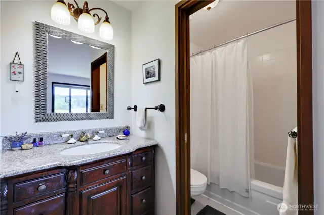 The updated, full bathroom in the primary ensuite.