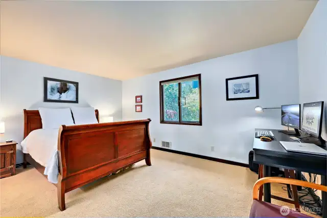 The guest bedroom is quite spacious and has its own exterior entrance, perfect for short-term rentals.