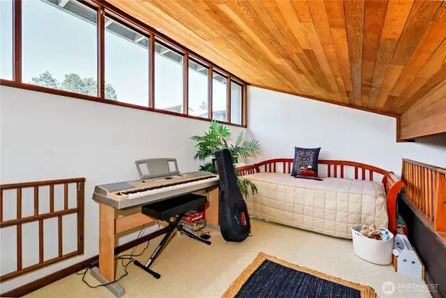 Clerestory windows, real wood ceilings make this loft a cozy and inviting space.