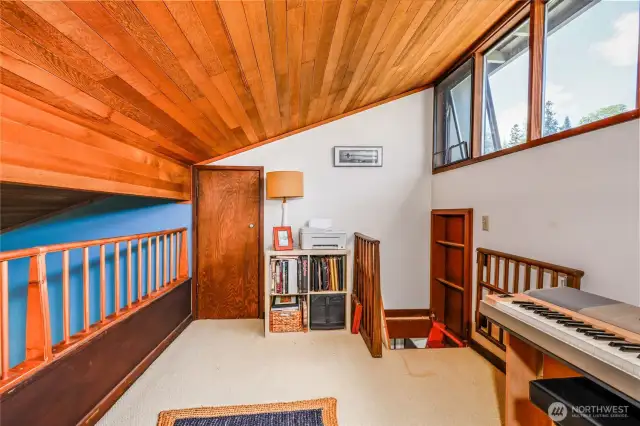 The loft space can be used for a den, music room, extra sleeping space or whatever you like. And there's a large storage room behind the door on the left - Bonus!