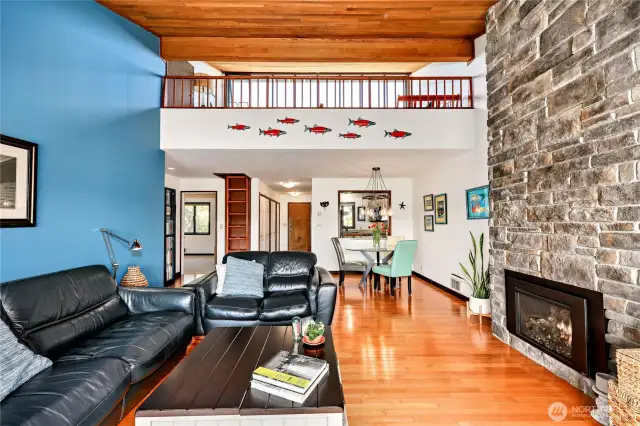 This particular condo has a loft and a bonus storage room! The stone wall is custom and the fireplace is propane.