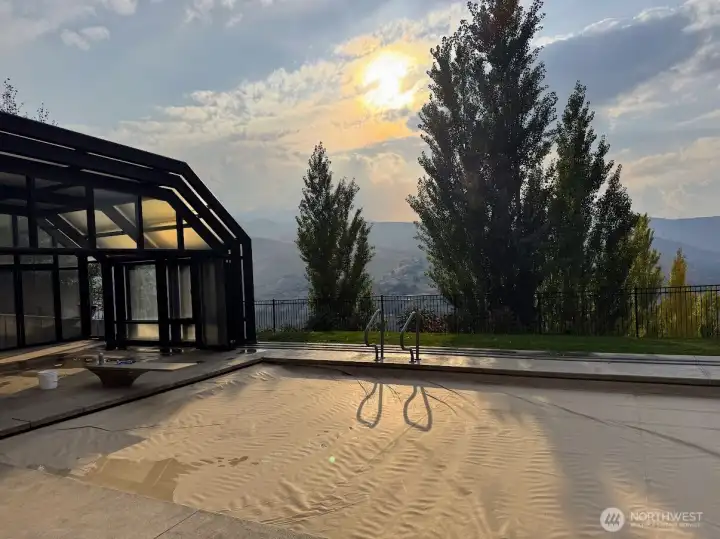 retracted enclosure,  can be fully closed, wide open or sides only open with roof still covering pool.