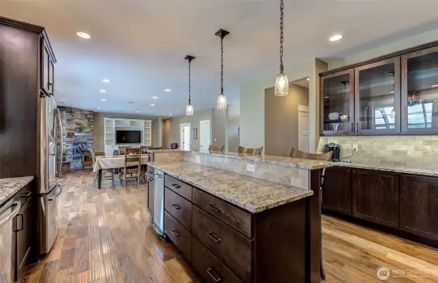 Beautiful kitchen open to the main living and walks out to the pool.