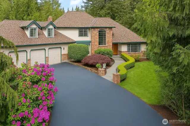 Beautifully updated 4 bedroom or 3-bedroom + den and bonus with a main floor 3/4 bath.  Feels like you're out in the country but in a neighborhood.  Oversized 3 car garage with shop space at one end.  Circular drive. The roof is long lasting CertainTeed Presidential TL, 50-Year, high-definition composite asphalt shingle.