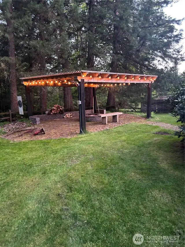 Evening view of the pergola with the lights.
