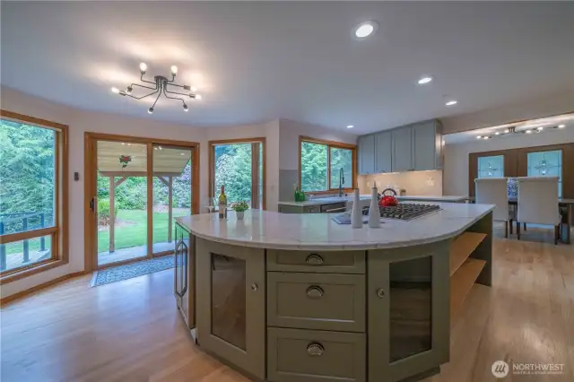 Amazing island...with climate control beverage fridge, shelves, drawers and more.  View looks out towards the covered BBQ area for all season covered barbecuing.