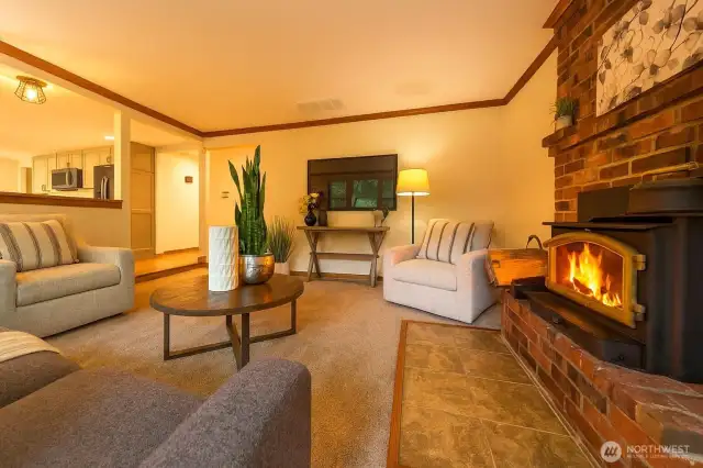 Cozy family room with woodburning fireplace/stove.