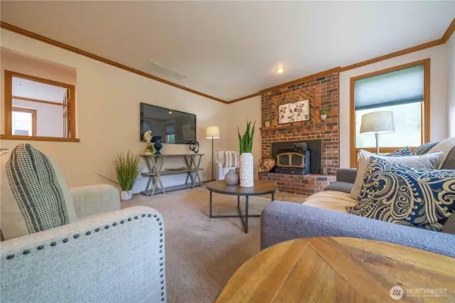 Another view of the family room with woodburning fireplace/stove.