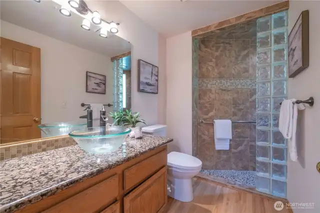 Updated 3/4 bath on the main level, across from the Den.