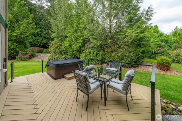 Details are everything.... TimberTech Collection, "Weathered Teak Deck" in herringbone patter with hidden screws.    The metal deck railing features vinyl coated wire and remote low voltage under deck rail lighting.  You won't see a nail or screw on this deck and the railings are lighted at night.   AND... on a clear night you can see the satellites cross the sky...West to East and North to South from the hot tub.