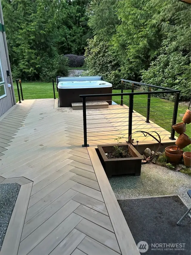 Another view of the herringbone deck and hot tub.  Plenty of room to entertain!