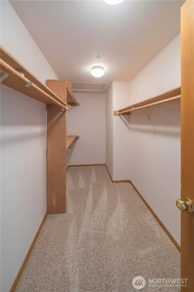 Spacious primary walk-in closet.