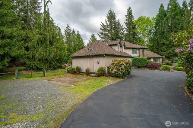 Plenty of room to park that RV or boat.  Seller had a large portable cover over the area for their RV.  Off to the far right of the house are 3 beautiful redwood trees.