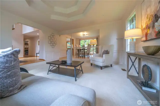 Elegant living room off the entry and adjacent to the dining room.