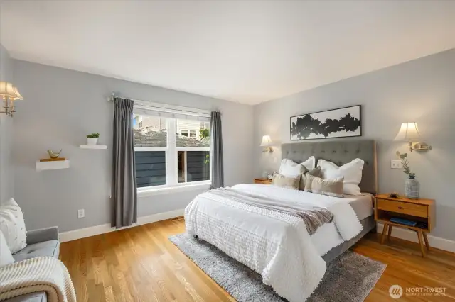 Large Primary bedroom that overlooks the backyard, providing privacy and green views!