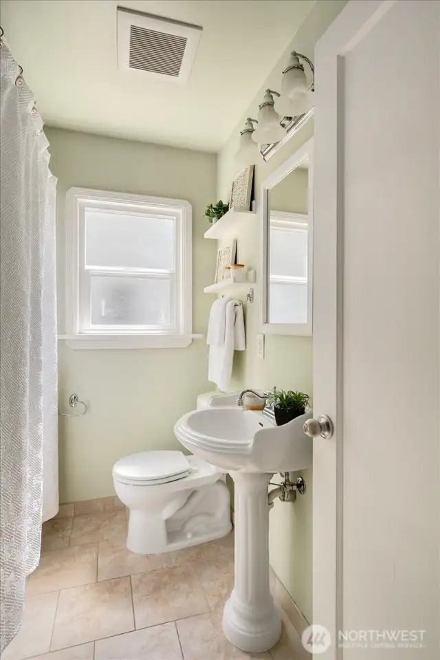 Separate hallway guest bathroom on the main level makes this floor plan a wow!