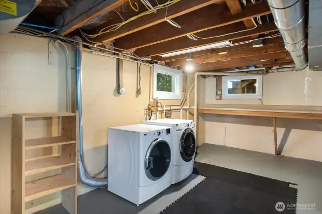 Spacious basement utility room, ideal for laundry, storage, and everyday essentials.