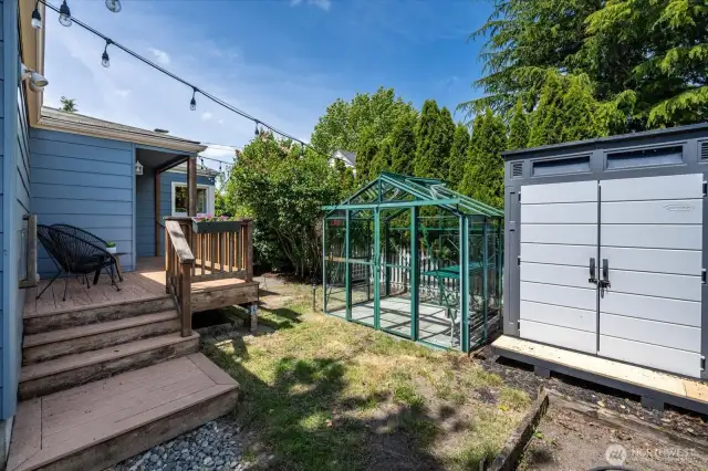 Greenhouse for the home gardener and storage shed next to conveniently store your gardening tools!