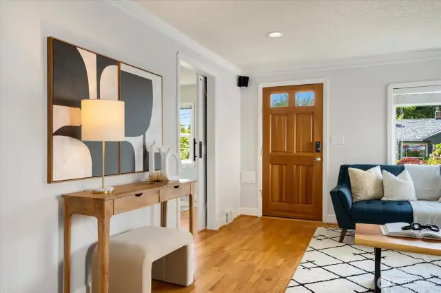 As you enter, gorgeous hardwoods greet you throughout the home!