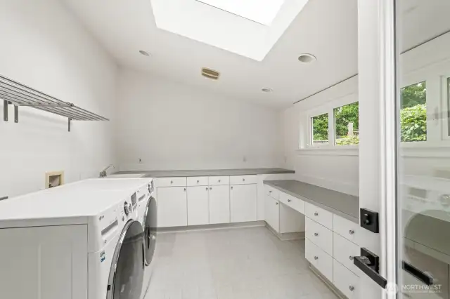 Massive laundry room with storage galore!