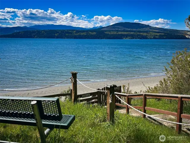 Neighborhood amenities include a private beach.