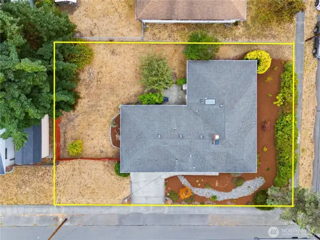 Spacious corner lot and private, fenced yard ideal for entertaining, pets, and raised beds.