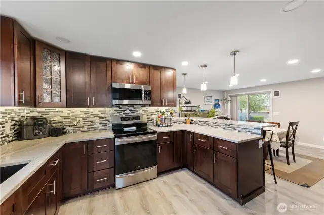 Bright, stylish kitchen with quartz counters and clean, contemporary lines.