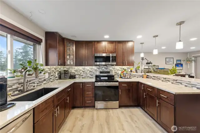 Stainless steel appliances and a deep undermount sink for a clean, modern look.