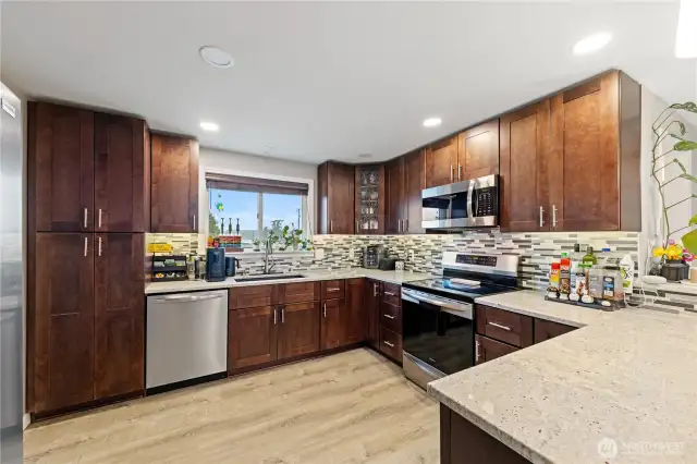 Kitchen with abundant cabinet storage plus a dedicated pantry.