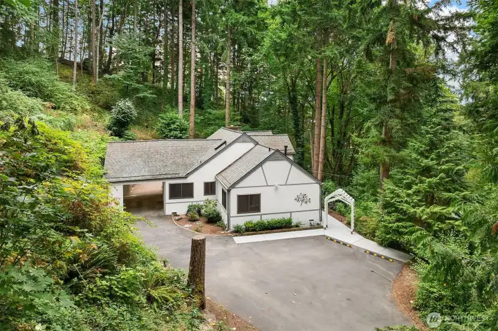 Surrounded by nature, 4 beds plus office/den.