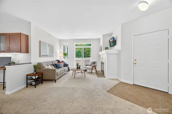 Tile entryway leads into living room