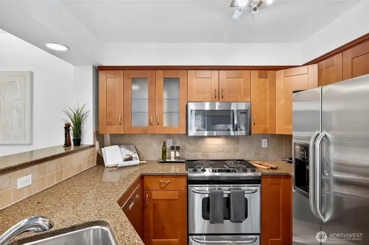 Kitchen with granite countertops and plenty of storage space
