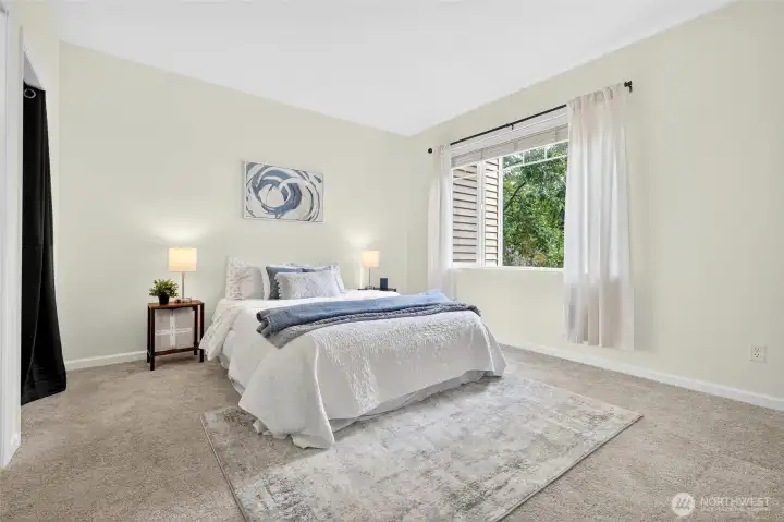 Primary bedroom is spacious enough for a king bed