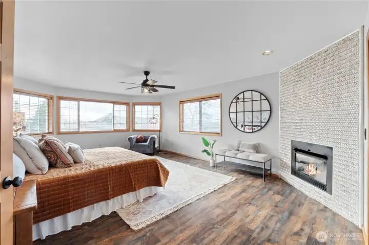 Relax in your massive primary suite with a gas fireplace!