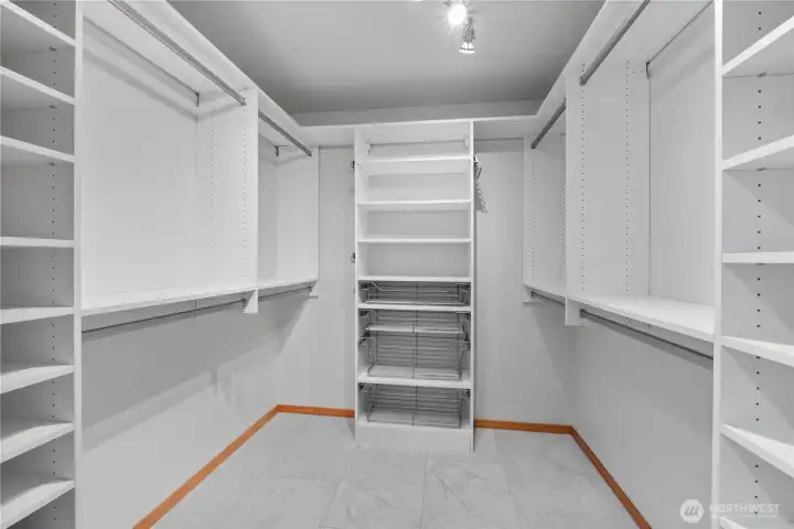 Custom closet storage in the primary suite walk in closet!