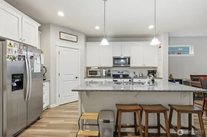 Island with eating/hanging out space.