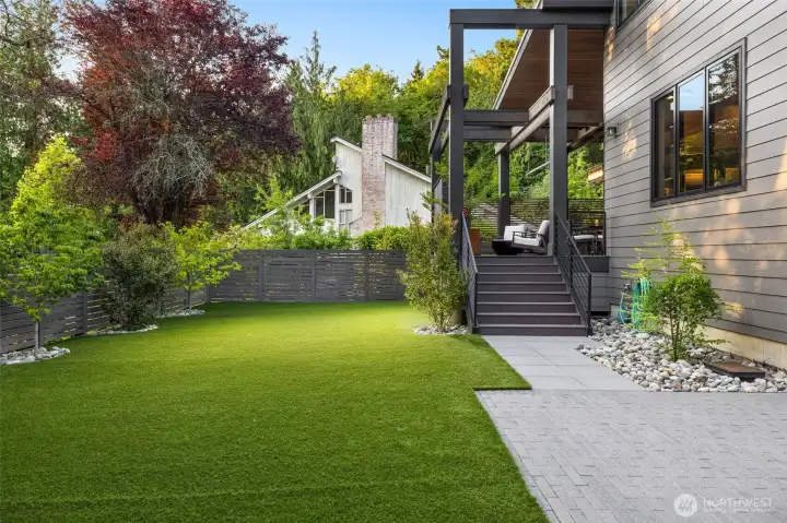 Spacious rear yard with care free, easy turf.