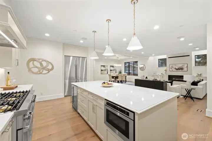 Custom chef kitchen with high end commercial appliances compliments this open concept living area.