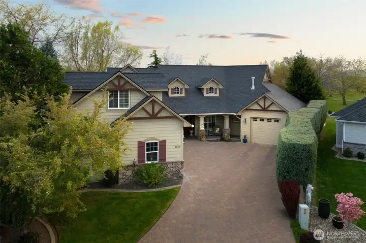 Paver driveway with timeless charm and durability. Leafless gutter system.  Exterior painted in 2022.