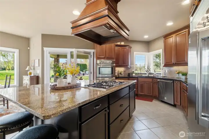 Gas cooktop, kitchen craft cabinetry with under counter lighting.