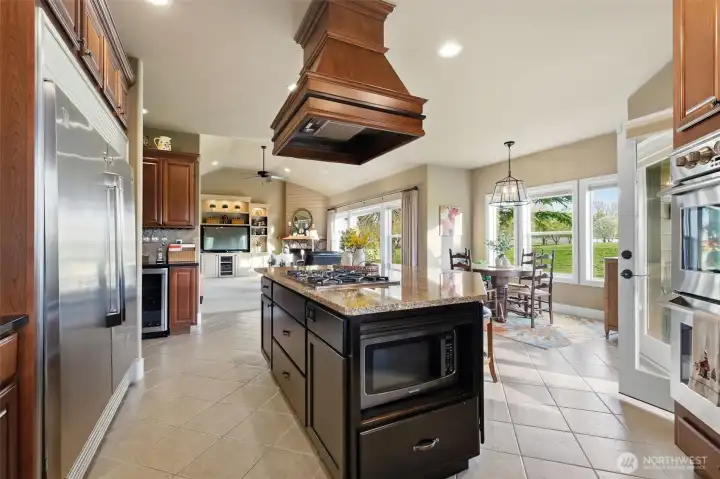 Under-counter microwave & wine refrigerator and built-in under cabinet stemware rack.