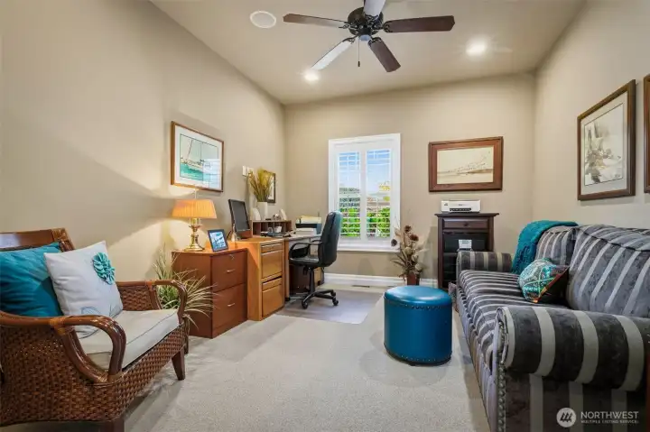 Private den or office with double interior sliding doors for added function and privacy.