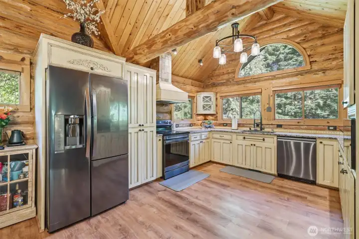 Beautiful kitchen with so many windows bringing the outdoors inside