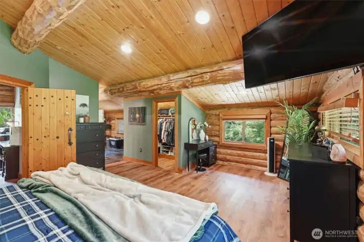 Luxurious private primary suite with heated floors and views of the outdoors.