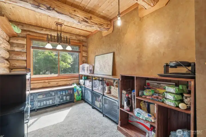 Extra room on the main floor use as an office, pantry, hobby room, library, so many options